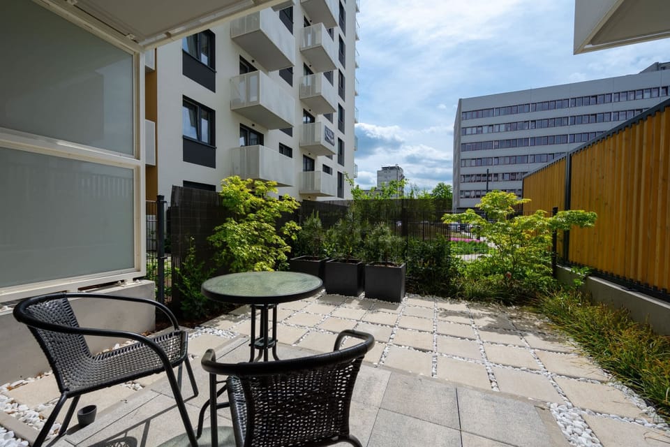 The terrace's stylish design complements the apartment's decor. 