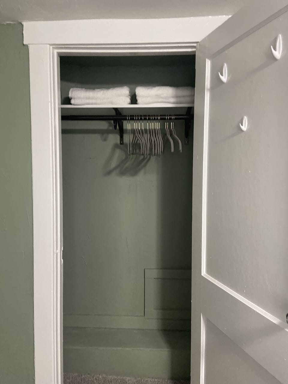 Linens, hangers, fans and luggage racks located in both bedroom  closets.