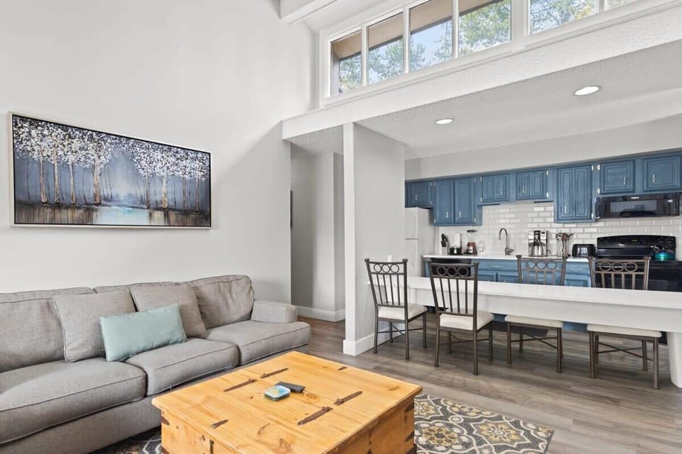 This view highlights the beautiful natural light in this home and the close proximity of the kitchen, living and dining areas, allowing you to stay connected to your loved ones no matter your activity of choice.