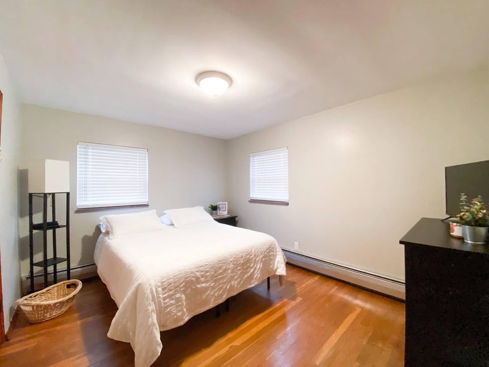 Bedroom 2 with Queen Bed. Room darkening shades have been added.