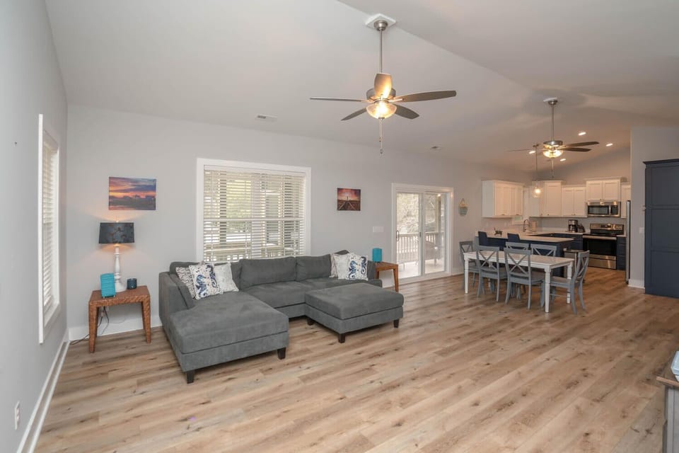 Large Living Area with open plan: Living room, dining area, and kitchen.