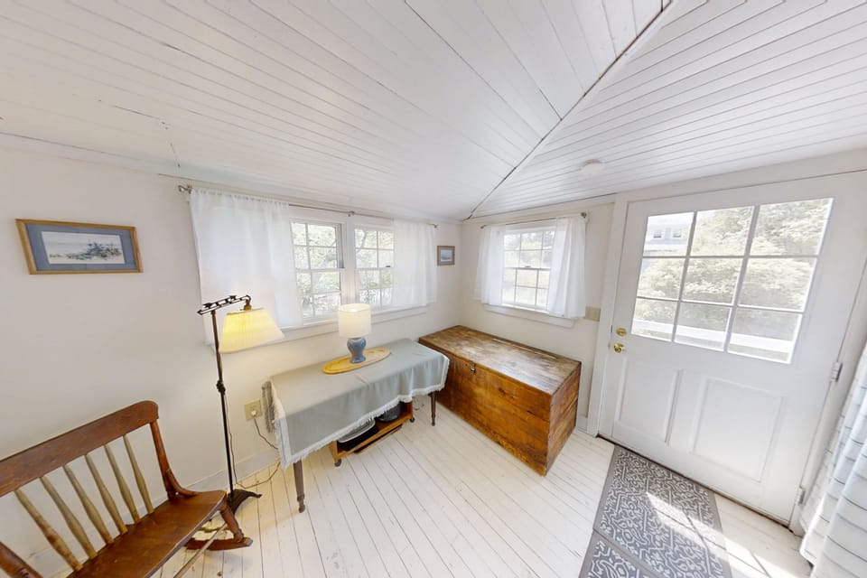 Off of the kitchen area is a half bath and sitting area.