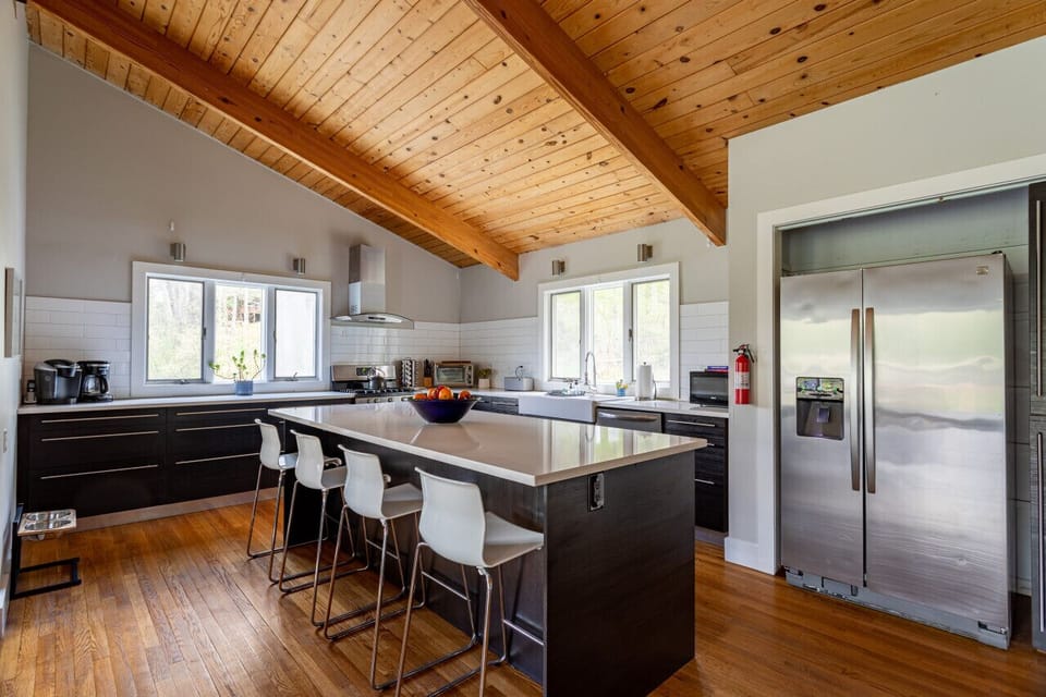 Fully stocked chef`s kitchen with breakfast bar