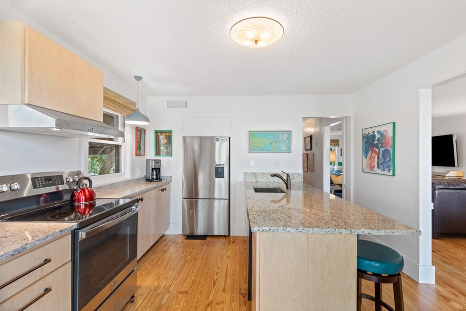 The kitchen in the home boasts a four person breakfast bar and updated appliances.