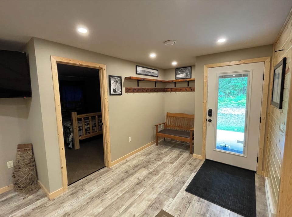Entry way; lots of hooks and storage space; Bedroom #3 to the left