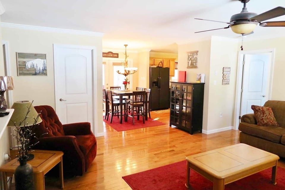 Living Room with gas fireplace, steps from both the Dining Room and Kitchen.