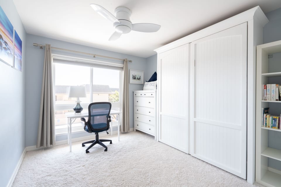 Murphy bed folds up to make space for an office