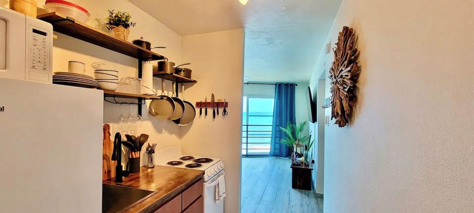 Charming Kitchen: Whip up delicious meals while enjoying ocean views and modern finishes!