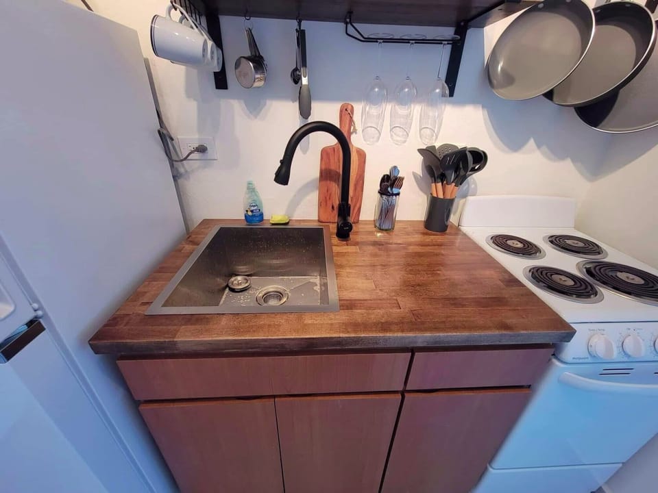 Kitchen: Sleek butcher block counters & modern appliances for your culinary adventures!