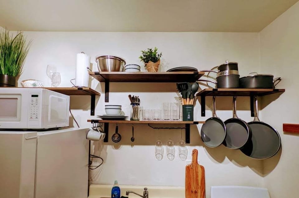 Charming Kitchen: Culinary adventures await in this well-appointed, stylish kitchen setup!