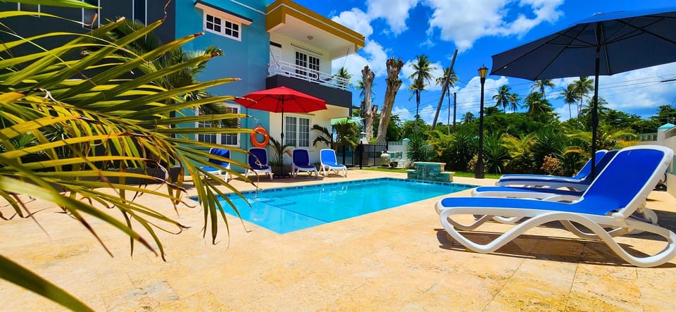 Poolside Paradise: Dive into relaxation beside the sparkling pool and swaying palms!