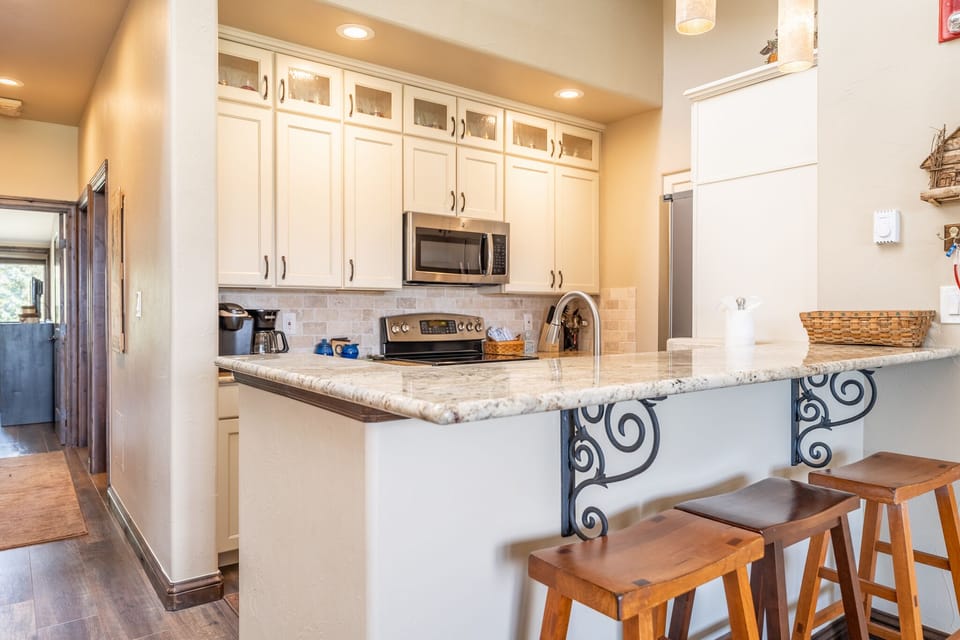 Breakfast bar with seating for three.