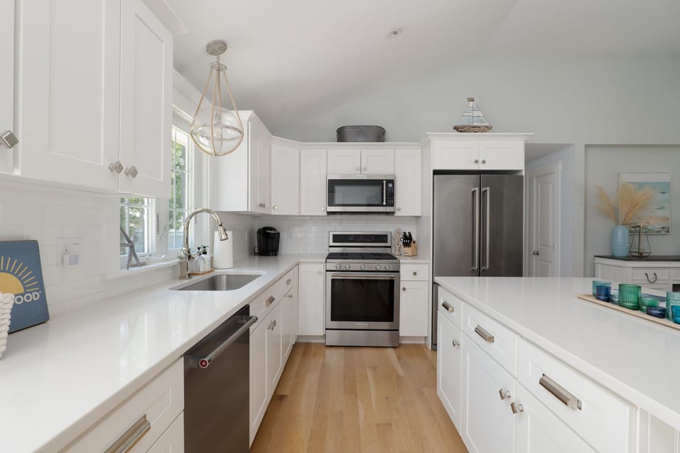 All new appliances and large quartz island with seating for 4
