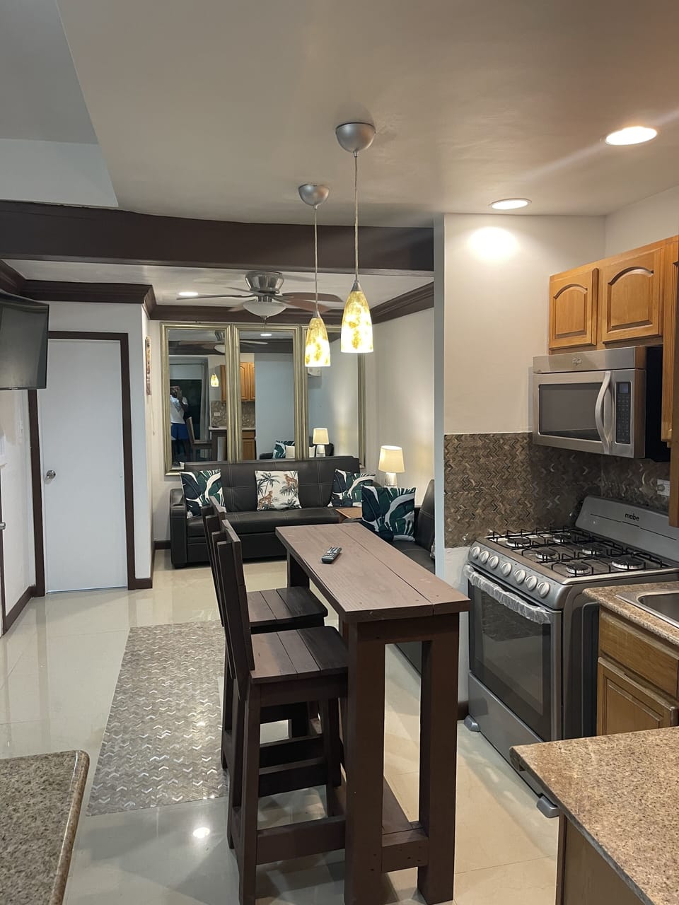 Newly renovated living, dining and kitchen with pool views!