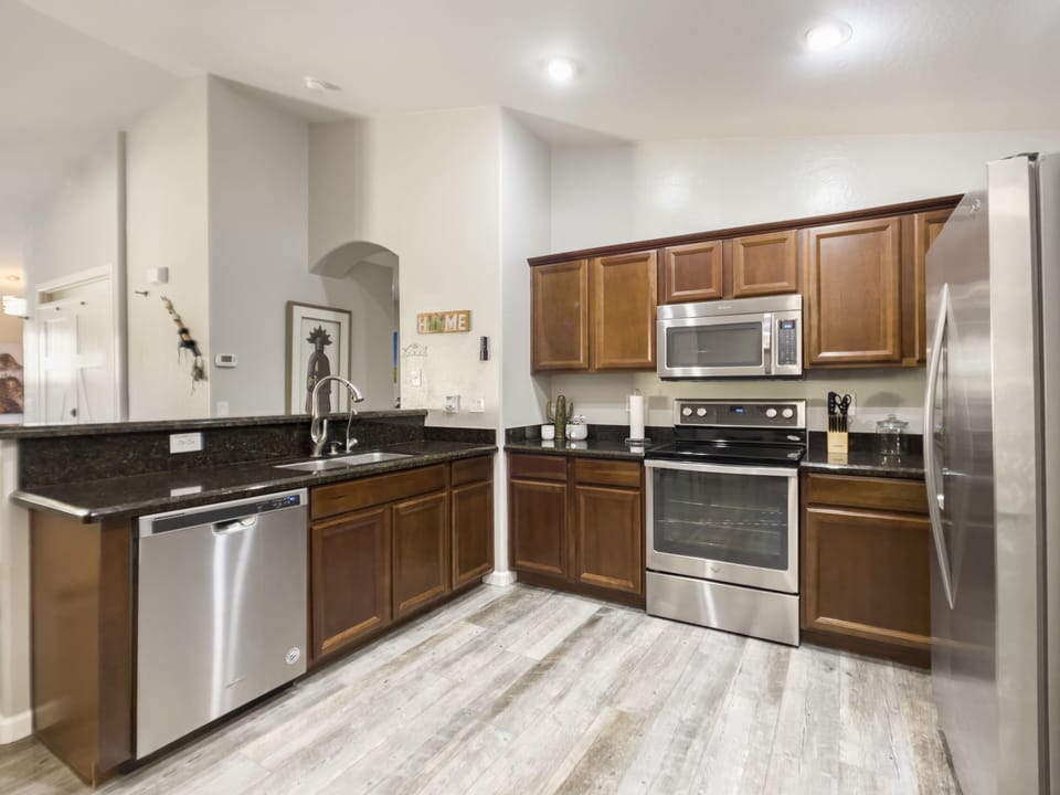 Large kitchen is fully stocked with everything needed to prep large meals