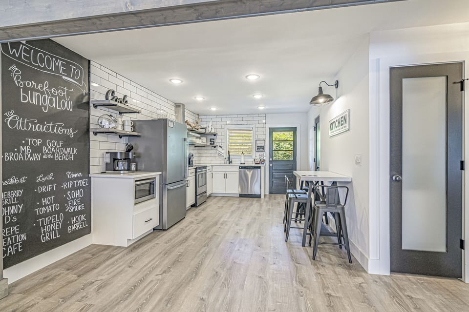 Open concept kitchen dining and living area.