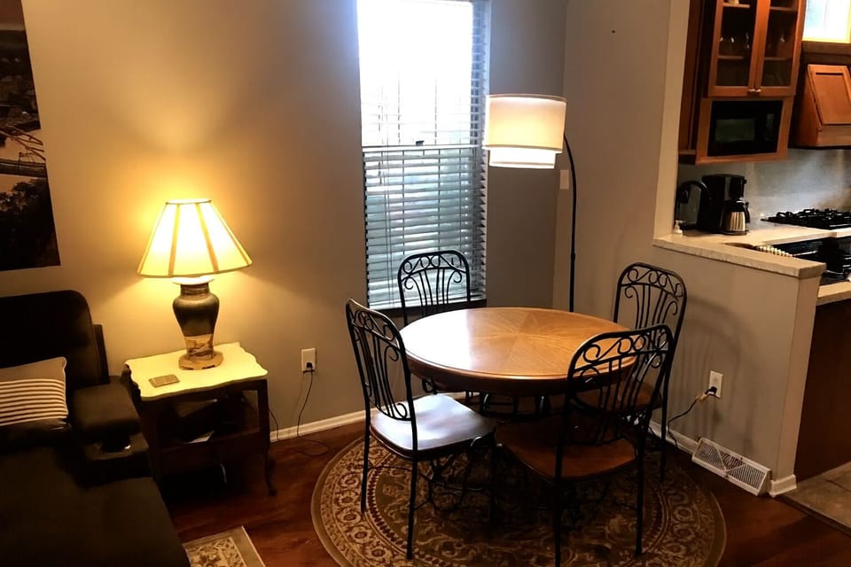 The dining area with a window overlooking the side yard