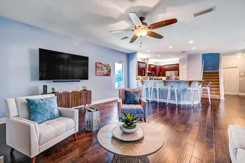 Open and spacious area full of natural light and a smart TV sit back and relax.