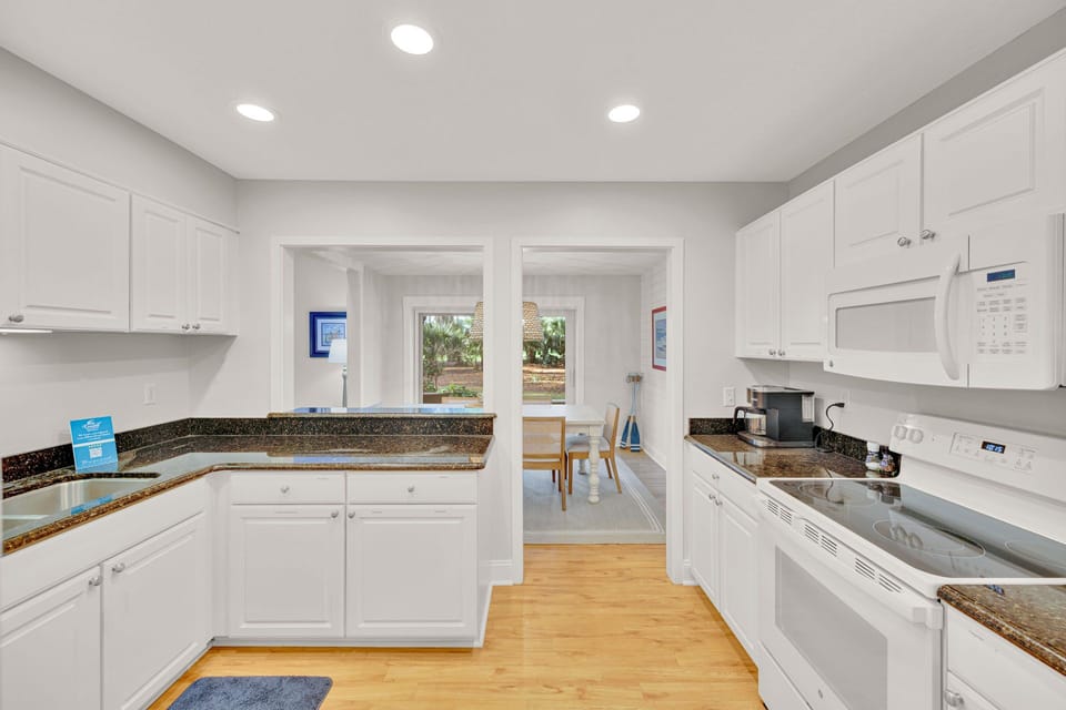 Kitchen with stainless steel appliances and fully stocked.