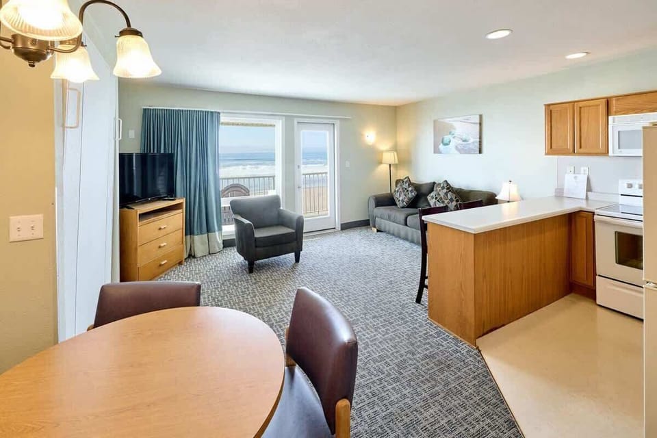 The unit has a full kitchen and front-row view of the ocean