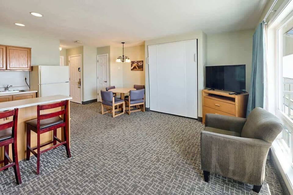 The Murphy bed folds up out of the way during the day