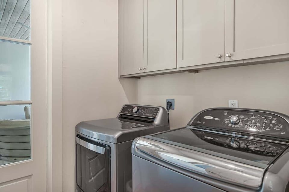 Laundry room with full size washer and dryer