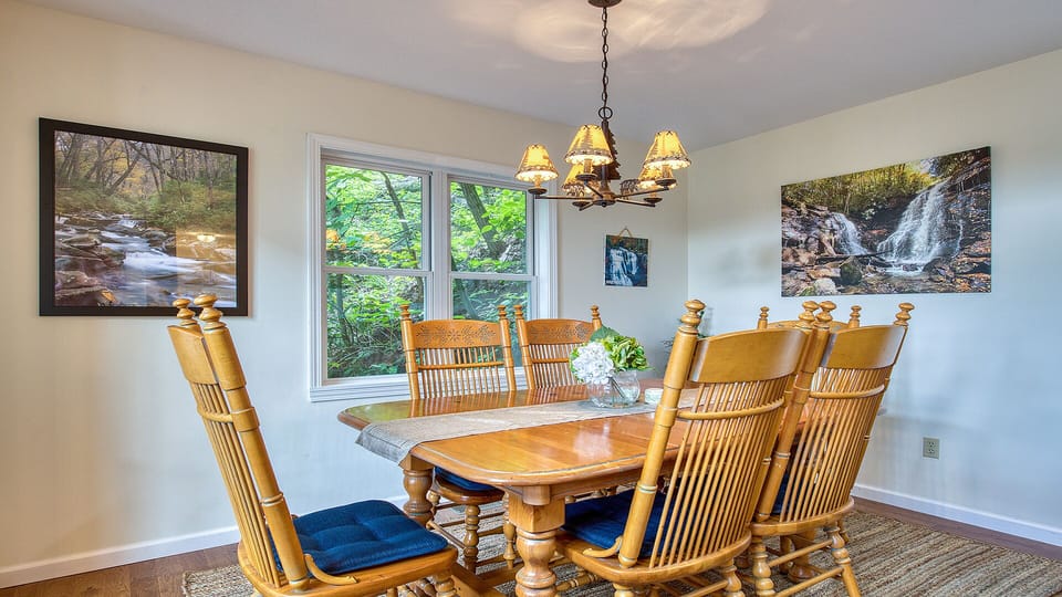 The spacious dining room table seats six, but expands to eight, if needed. 