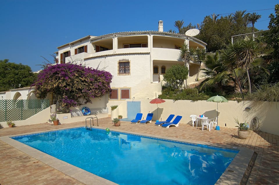 Villa Lorena has a secure pool area consisting of a large pool surrounded by a spacious terrace with outdoor shower. There are sun loungers, parasols and smaller seating areas available.