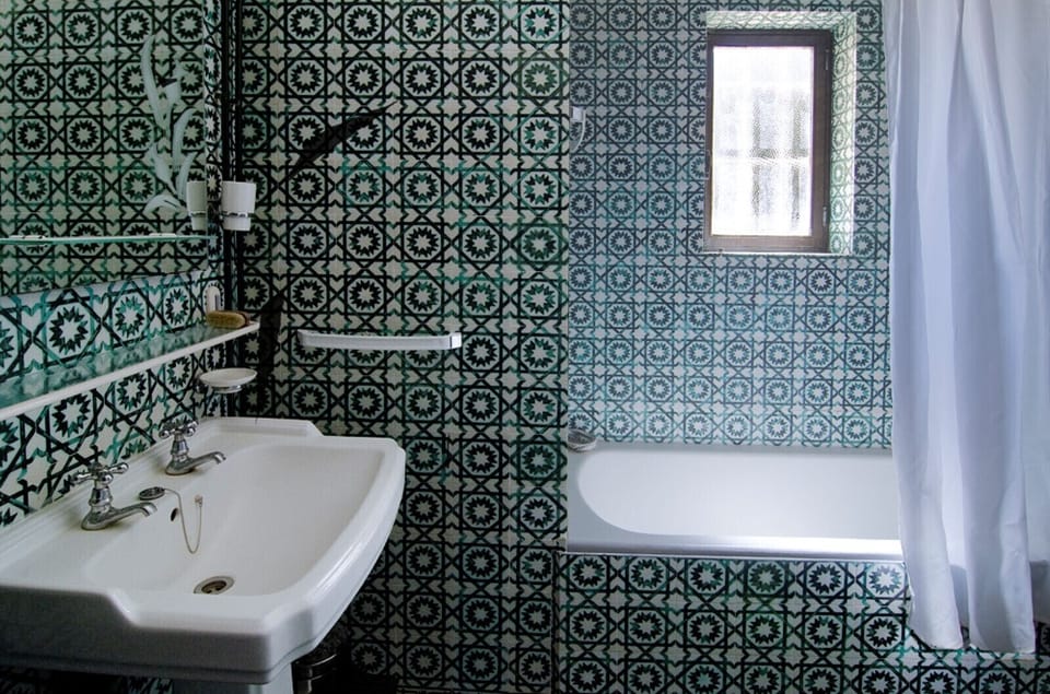 The bathroom at Villa Lorena is equipped with a bathtub.