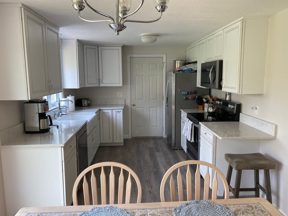 renovated kitchen featuring all new cabinets, plumbing fixtures & appliances
