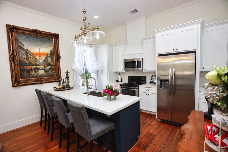 Gourmet kitchen w/ stainless steel sink,  appliances & custom cabinets  