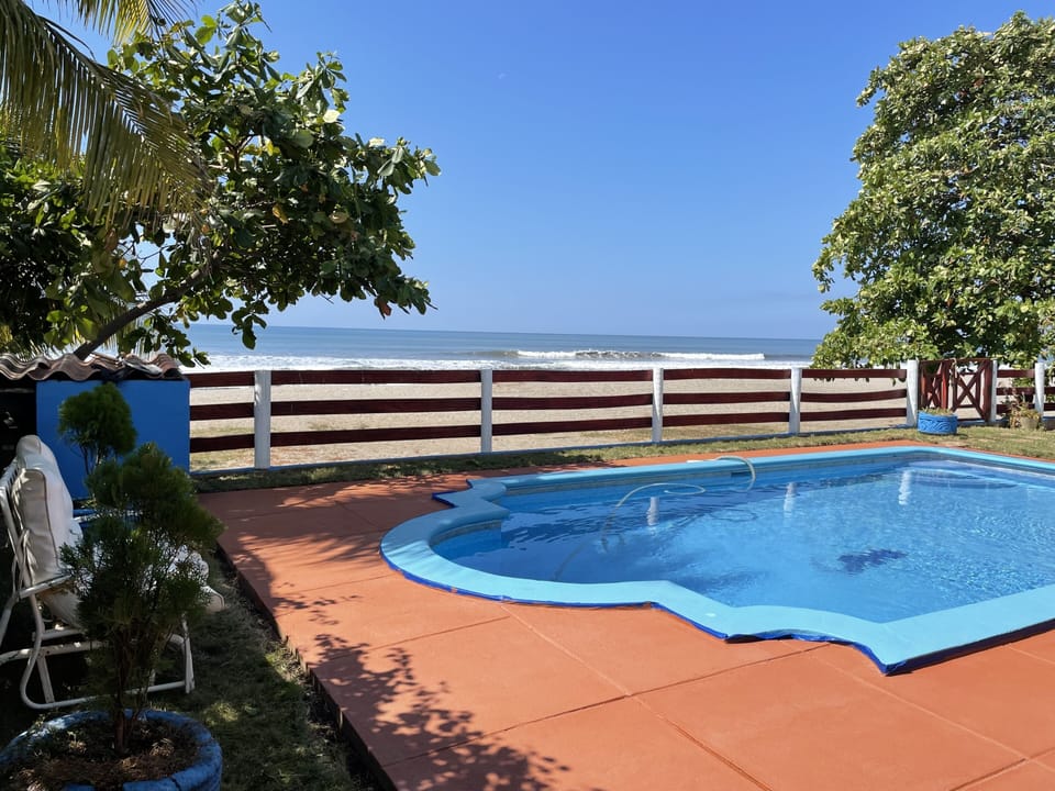 Pool area steps from the beach !