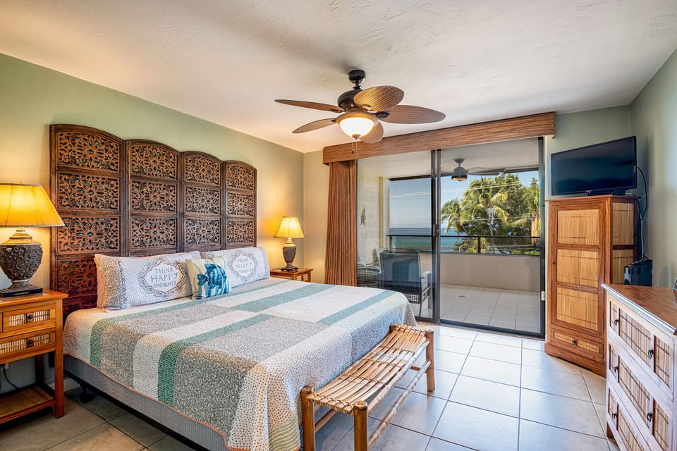 Luxury Master bed room with amazing ocean view. Ocean-view master suite featuring a comfortable king bed and direct access to the lanai for ultimate relaxation.