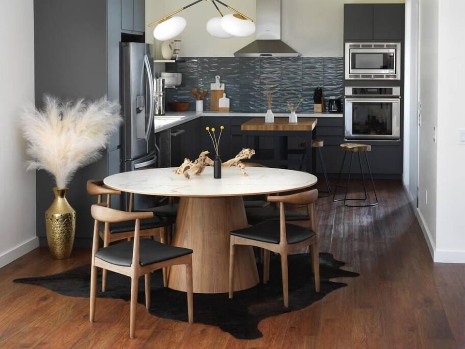 Prepare culinary delights in the fully-equipped kitchen, where modern design meets functionality. The luxury Thermador appliances and designer aesthetics create an ideal space for cooking and entertaining.