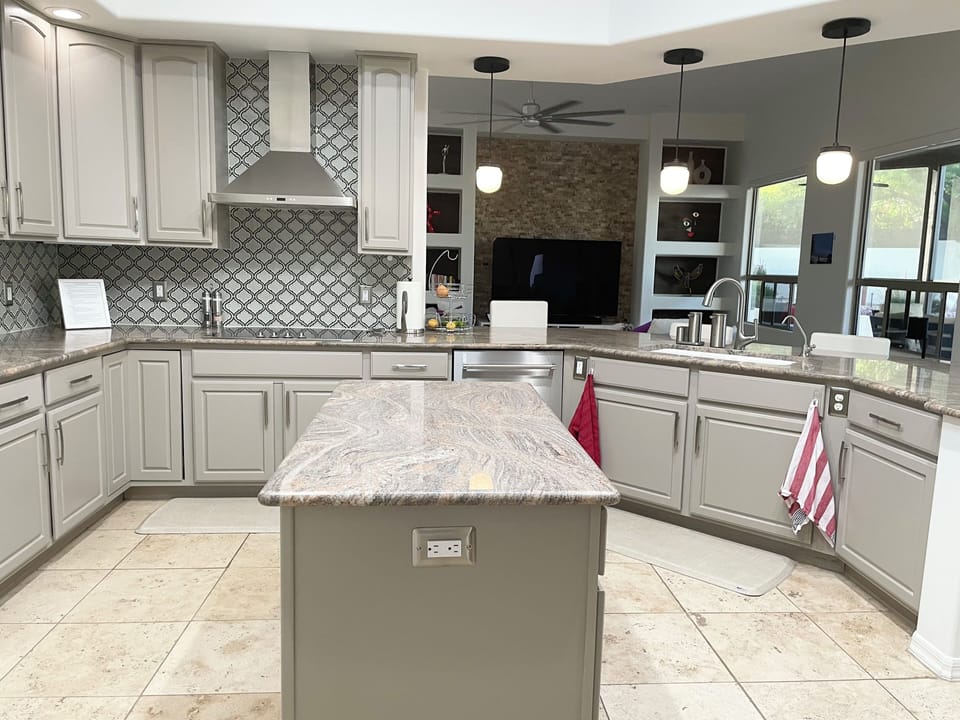 Kitchen flows into family area.