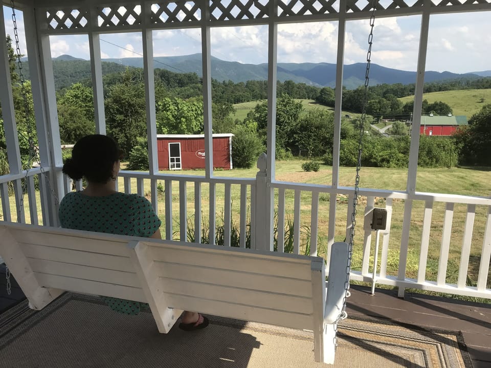 Enjoy breathtaking views of the Blue Ridge Mountains from our porch swing.