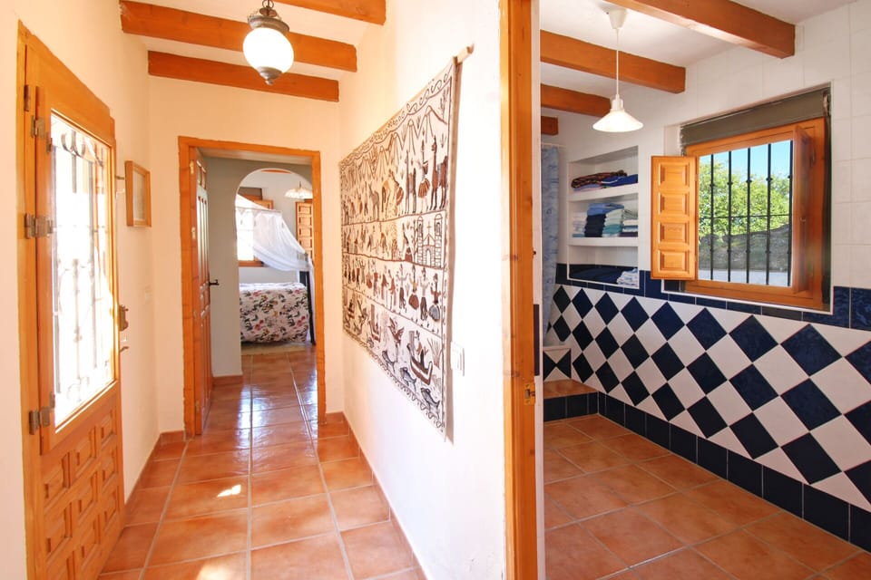 The second hallway with the second bathroom leads to the other bedroom . 