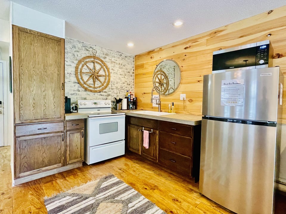 Updated kitchen w/ electric range top/ oven, NEW fridge and 1.1 cu microwave
