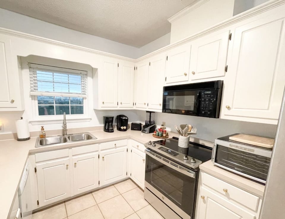 Kitchen with brand new oven and refrigerator. 