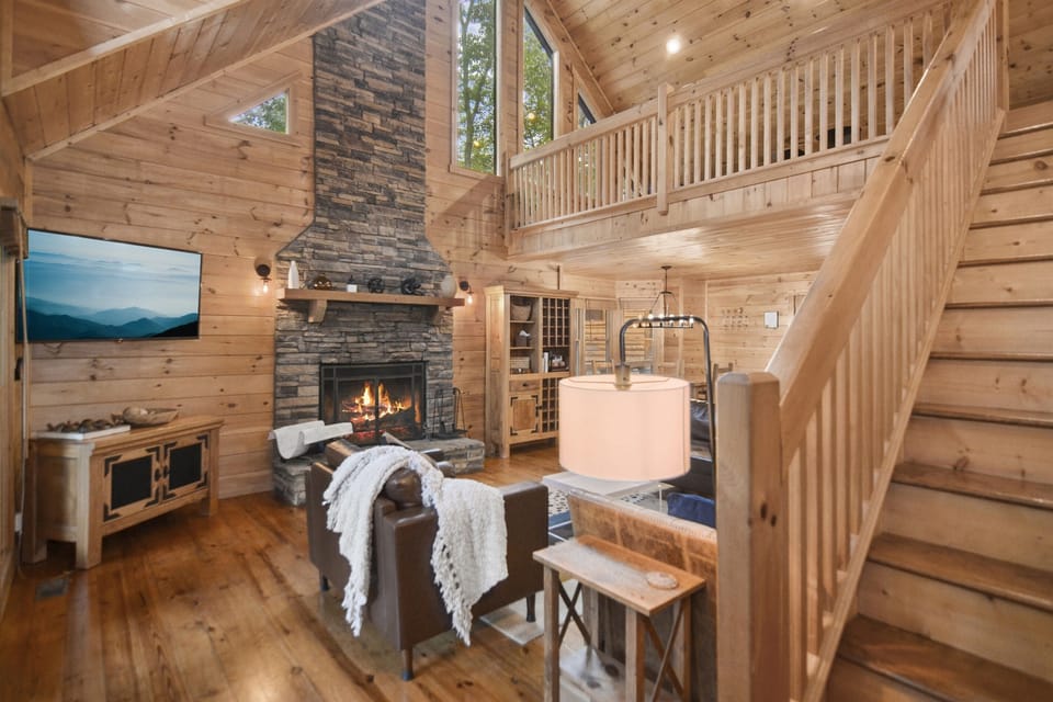 Main Living Room with high ceilings, TV, Cozy Fireplace