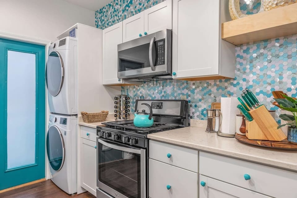 Discover sleek new stainless steel appliances, including a gas range, in the beautifully remodeled guest house! ✨ Plus, enjoy the convenience of an in-unit washer and dryer for effortless living.