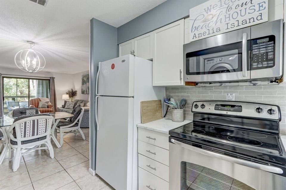 Bright White Cabinets in Sun-Filled Kitchen