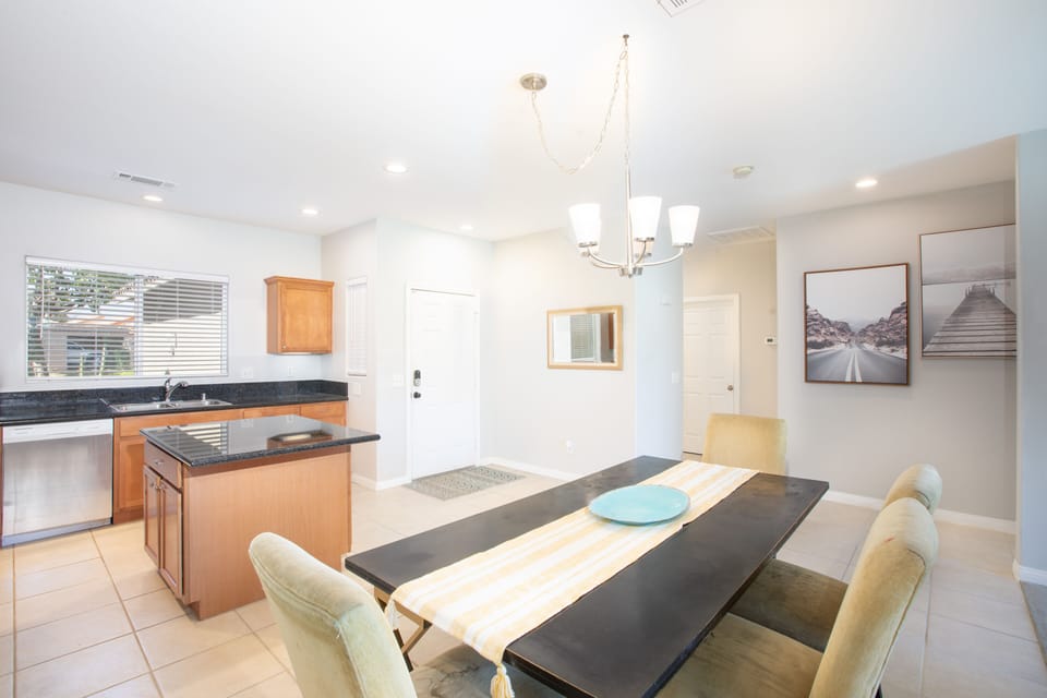 Kitchen with island and dining area.