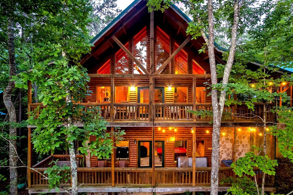 Charming Cabin Retreat: Nestled among the trees, three layers of decks to watch the distant mountains, and listen to the creek below. A+ location off of Wears Valley Road near the Parkway. check out the amazing bunk room, theater, arcade, & chef's kitchen