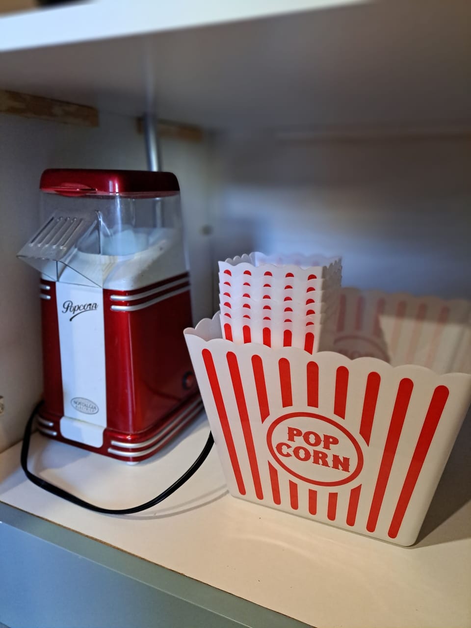 Kids of all ages love the novelty of the popcorn popper and movie theater style containers!