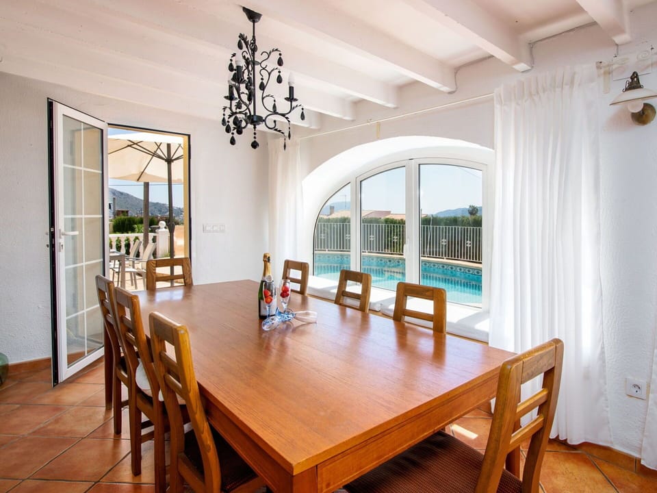 Furniture, Building, Table, Plant, Chair, Houseplant, Shade, Orange, Interior Design, Flooring