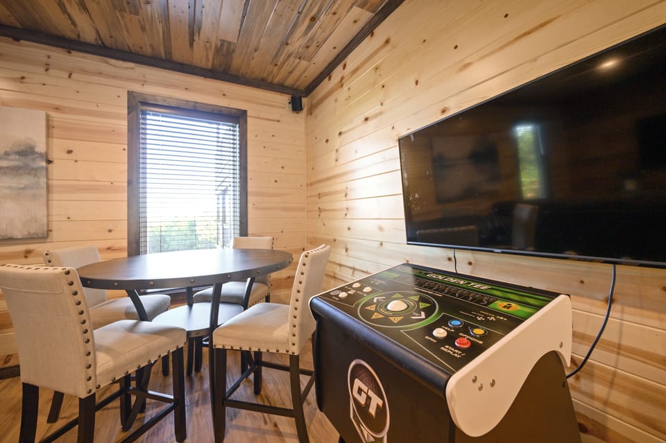 Arcade games and a table for cards.