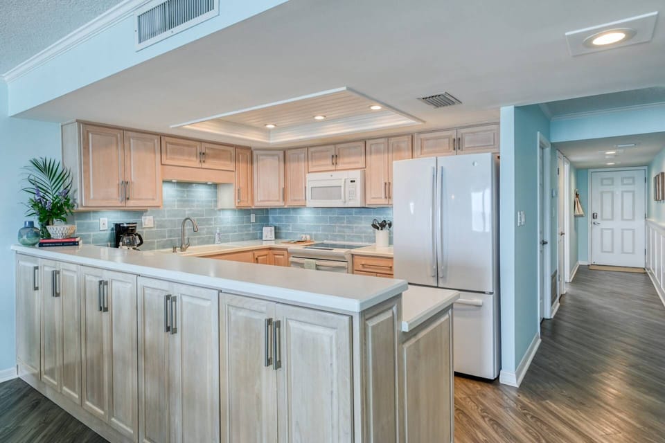 The kitchen is stocked with all the appliances you need to cook your favorite meal.