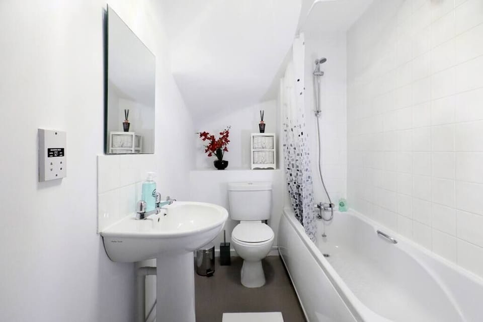 A well-polished bathroom you can use and can enjoy a relaxing bath in the bath tub.
