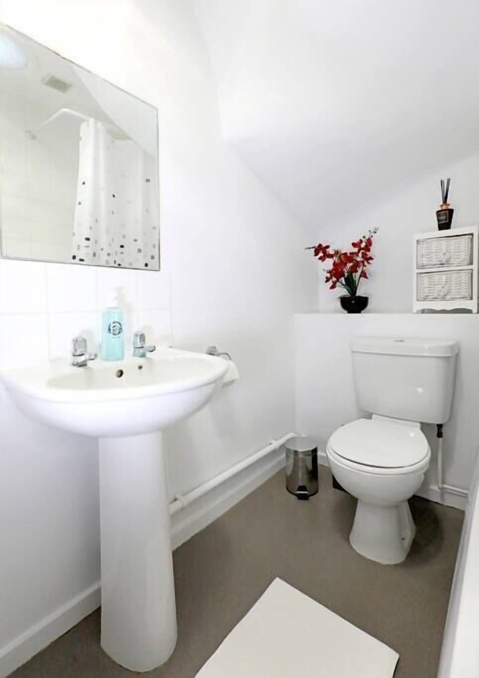 Bathroom with bath and overhead shower - toiletries and soaps are provided 
